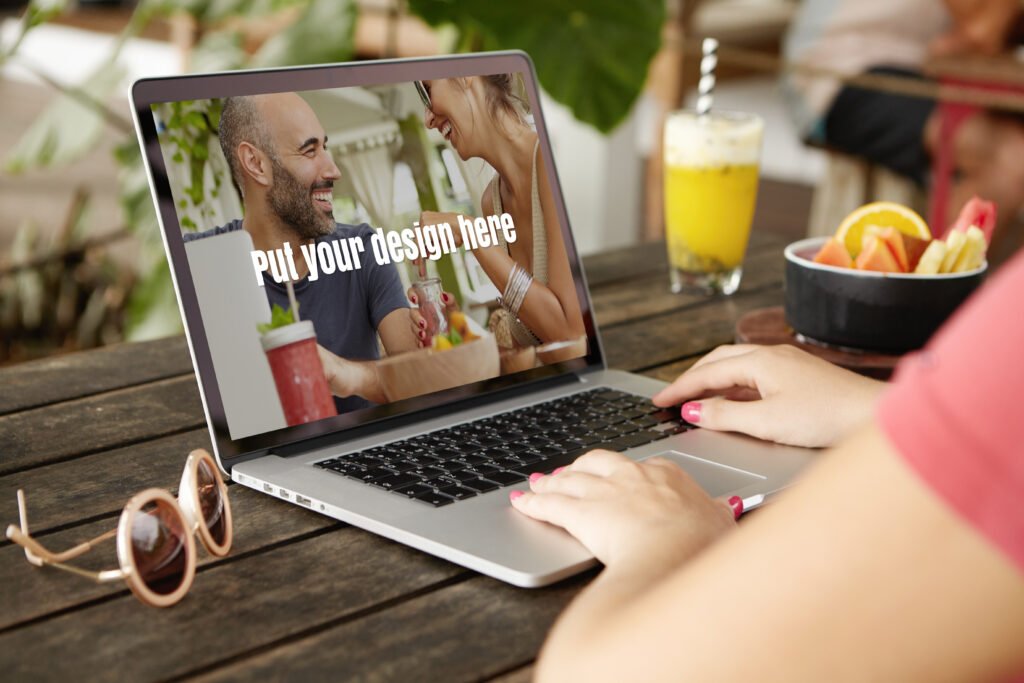 hands on laptop in a restaurant